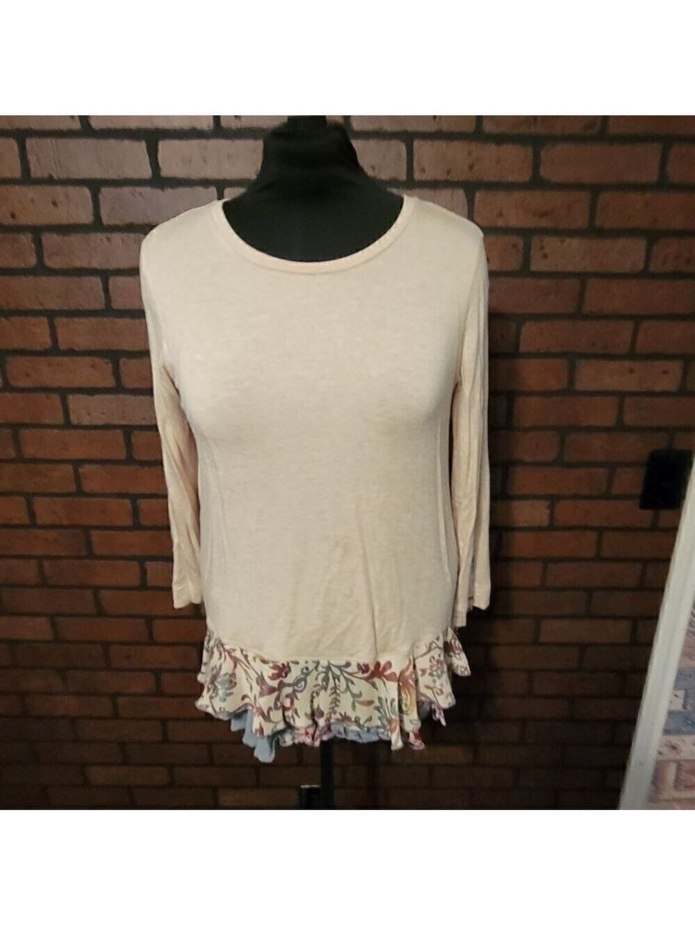 John Mark mixed material top with fabric ruffles and split up the back.